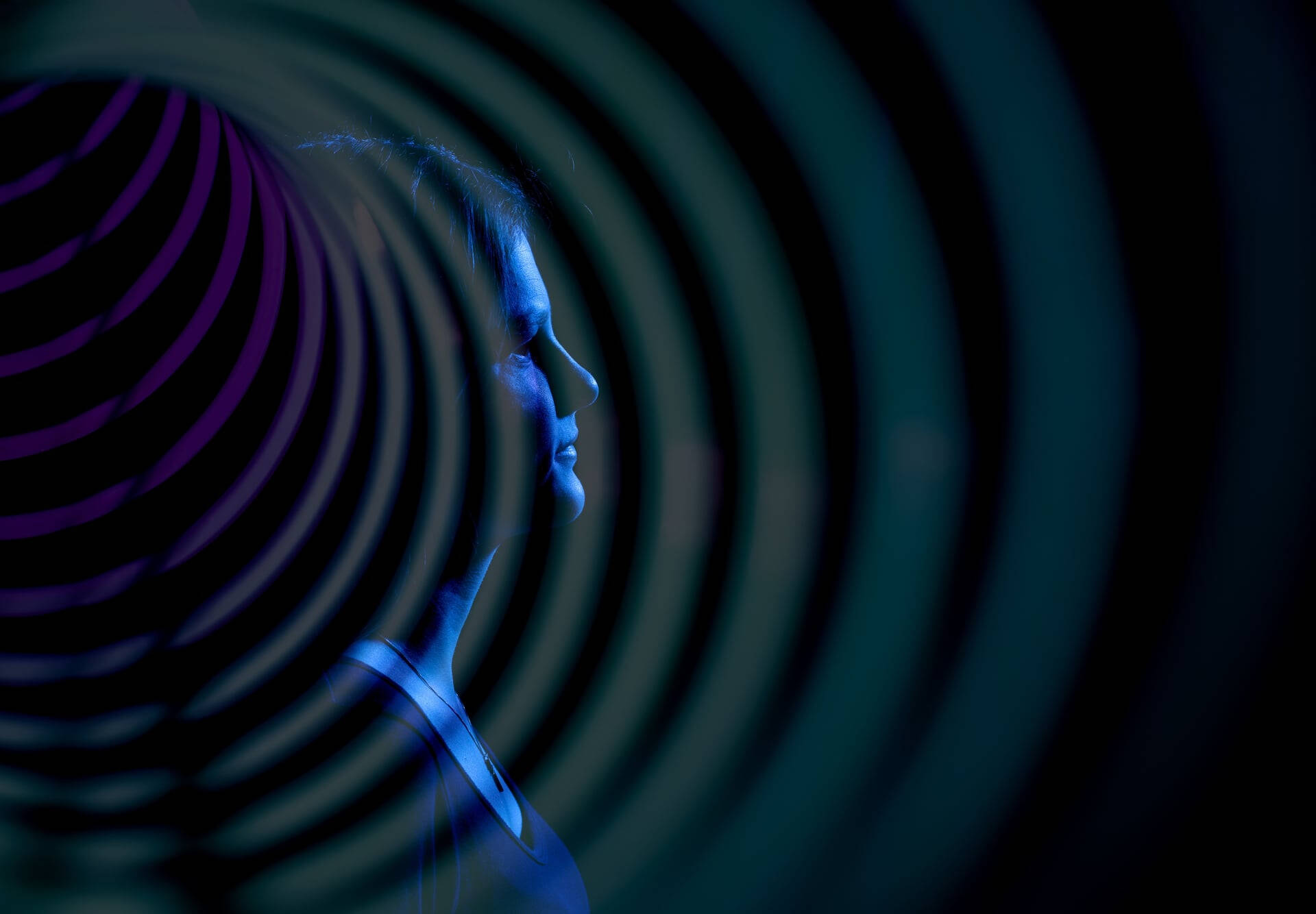 Savannah Tormala portrait is created with an oversized slinky toy to resemble sound waves